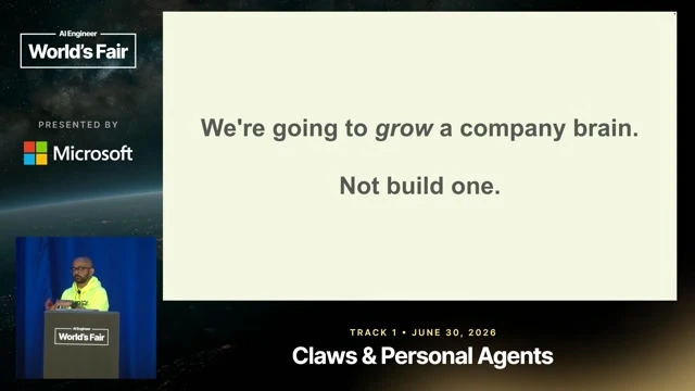 Captures the memorable design principle to grow a company brain through work rather than build it centrally.